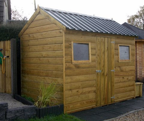 A wooden garden shed with a door centered in the 2m high side wall and windows on each side of the door. It has a Galvanised roof which is optional extra.
