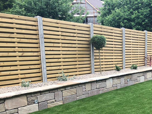Glan hit and miss fencing on concrete posts by Abwood